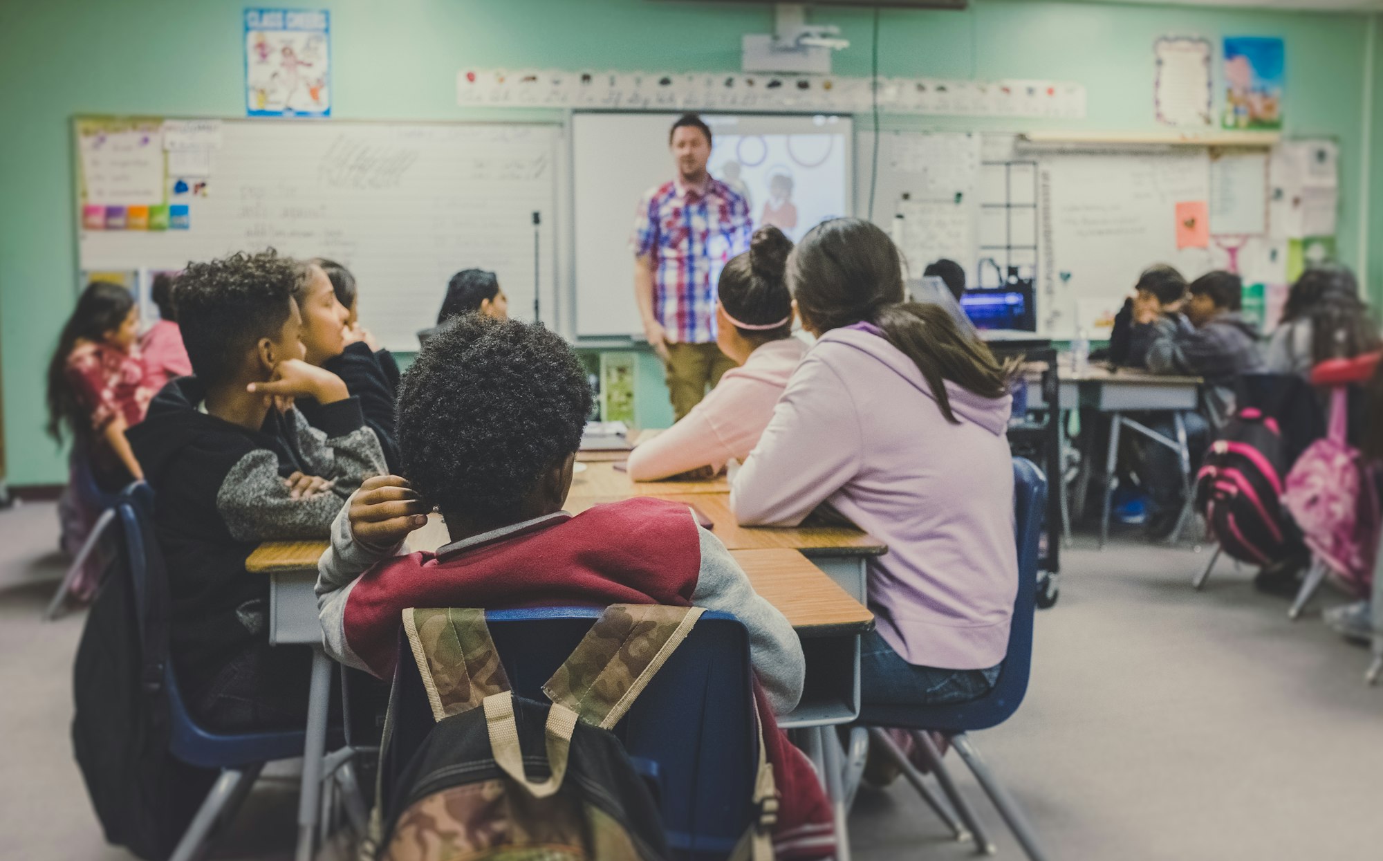 Students in a classroom using Colegios